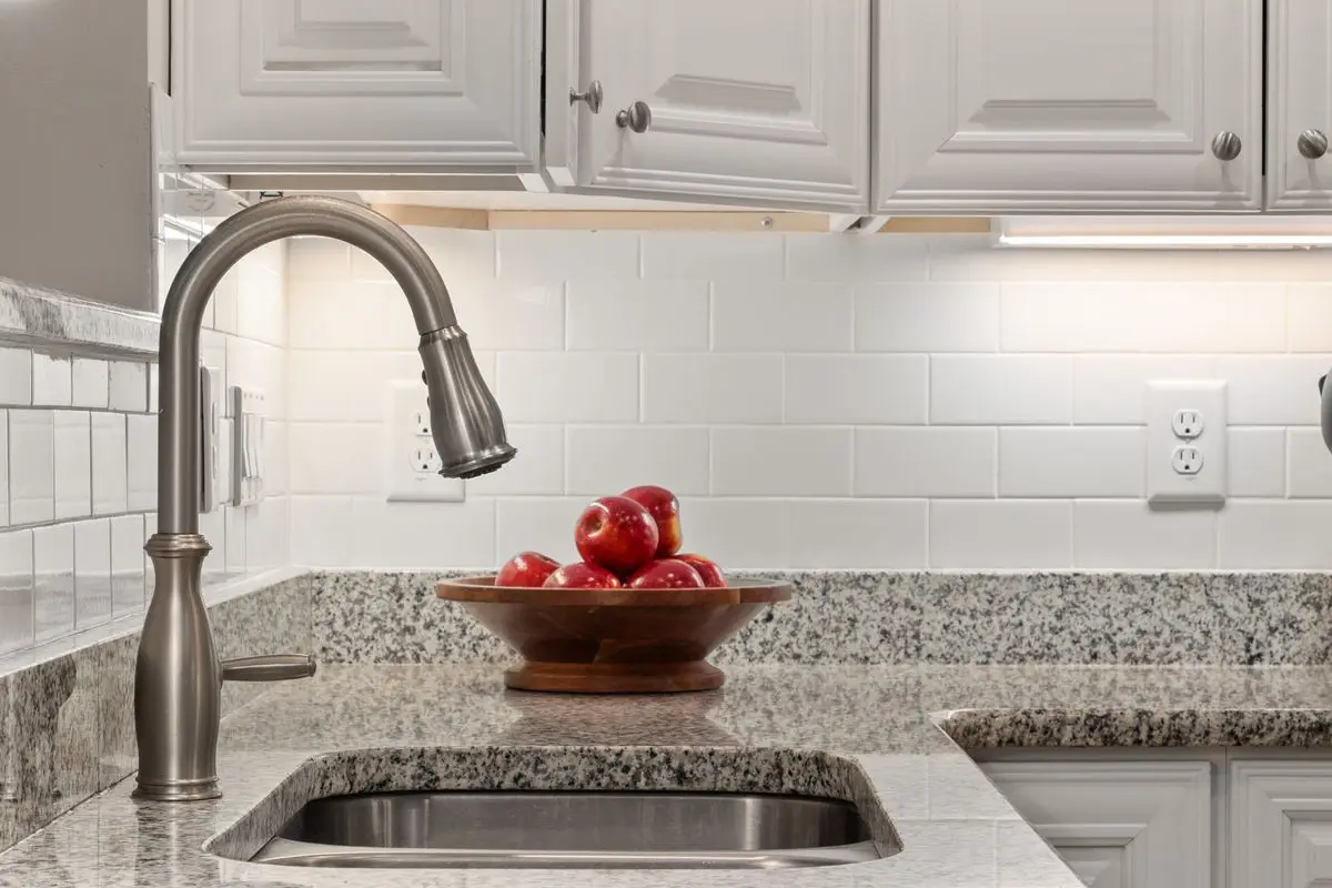 A bright residential kitchen with cabinets and counters. Rockford.